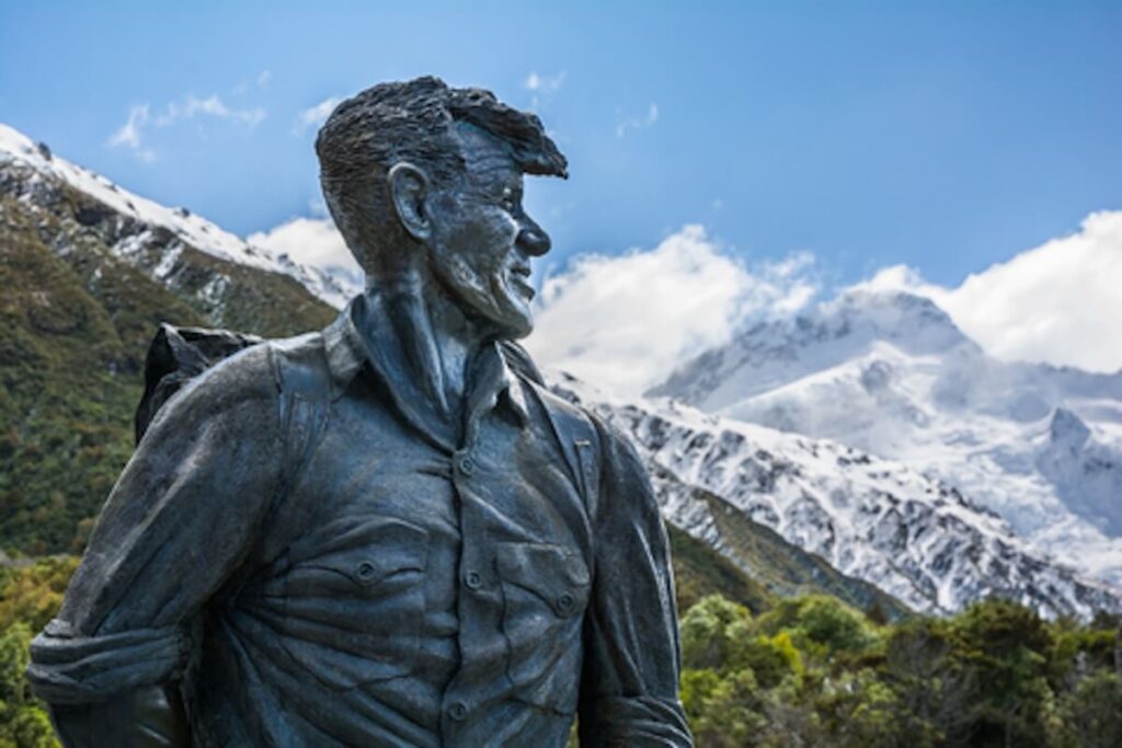 Sir Edmund Hillary Statue looking towards Aoraki / Mount Cook peak, New Zealand