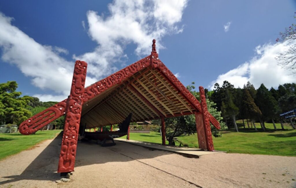 Carved Maori war canoe hut at the treaty grounds at Waitangi, North Island, New Zealand