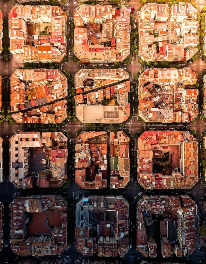 Drone shot of the iconic Eixample district grid pattern in Barcelona, Spain