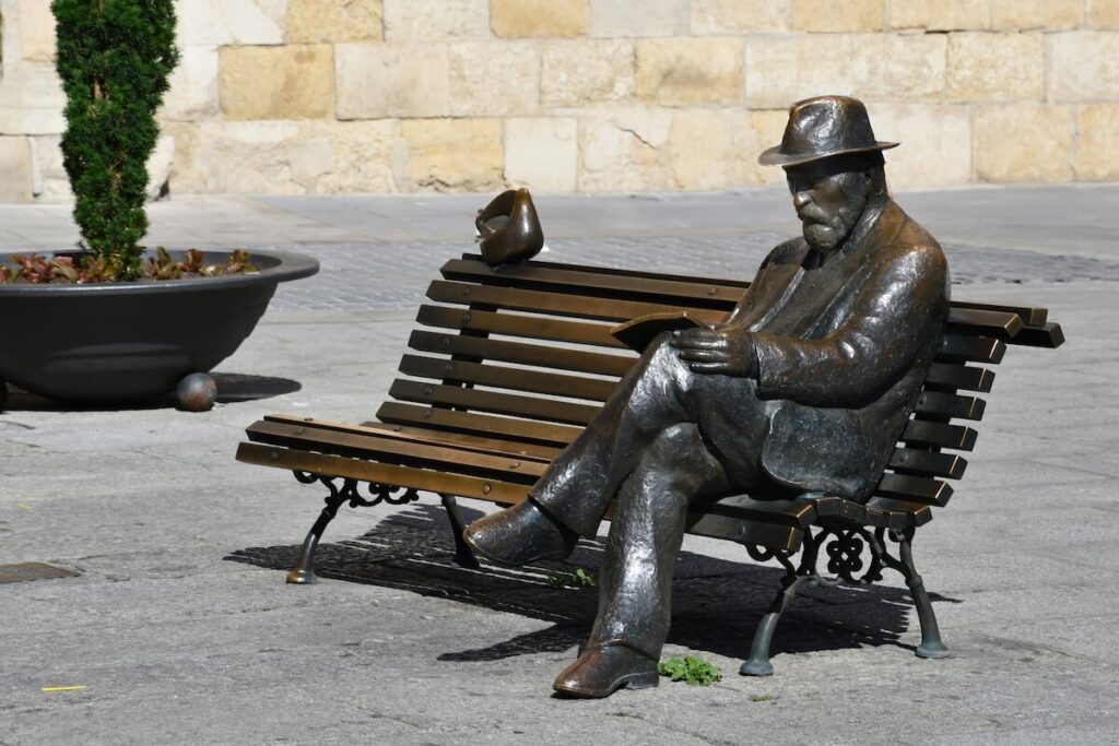 Bronze statue of Antoni Gaudi by J. Luis Fernandez installed in 2002 in San Marcelo square, Leon, Spain
