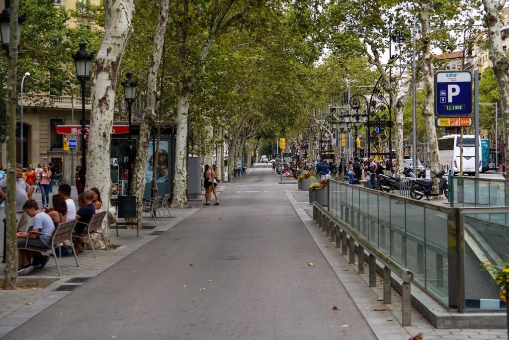 Bustling afternoon on La Rambla in Barcelona with people enjoying the lively atmosphere