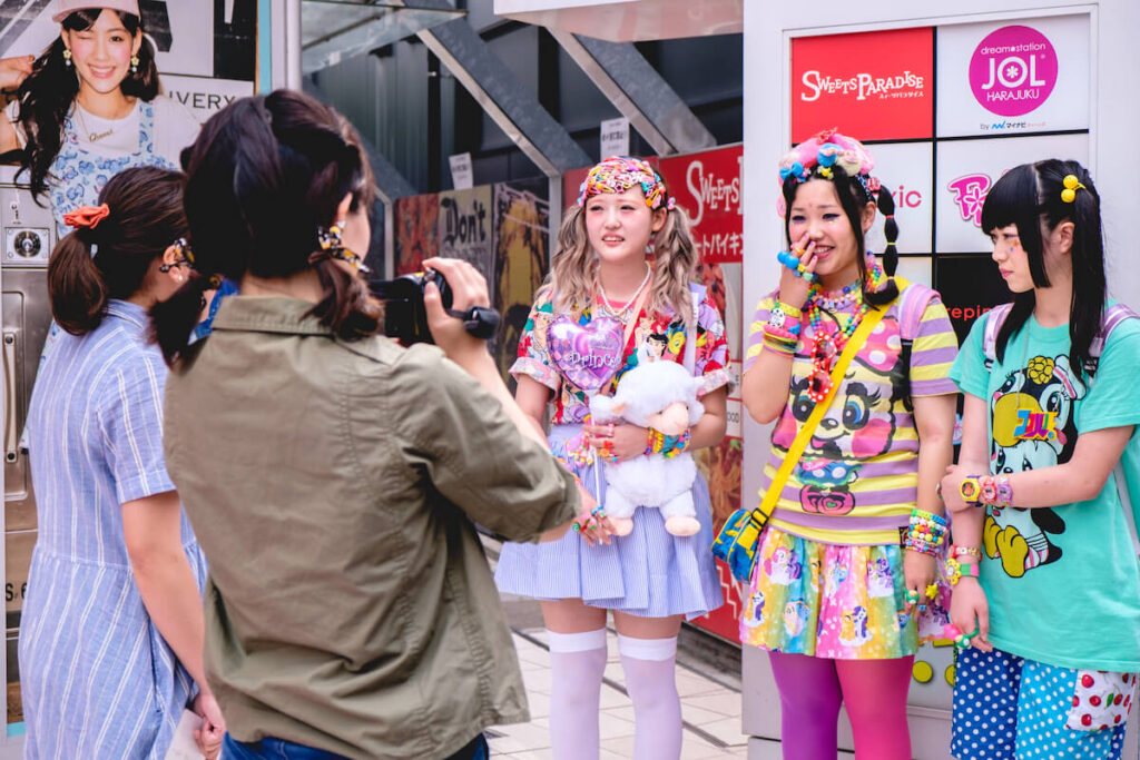 Cute (kawaii) japanese young girls (with 'decora' and 'oshare' style) being interviewed in tv at Takeshita street in Harajuku