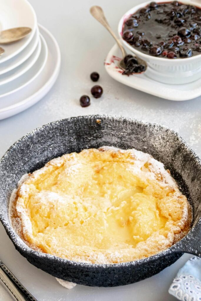 skillet with dough for blueberry pie