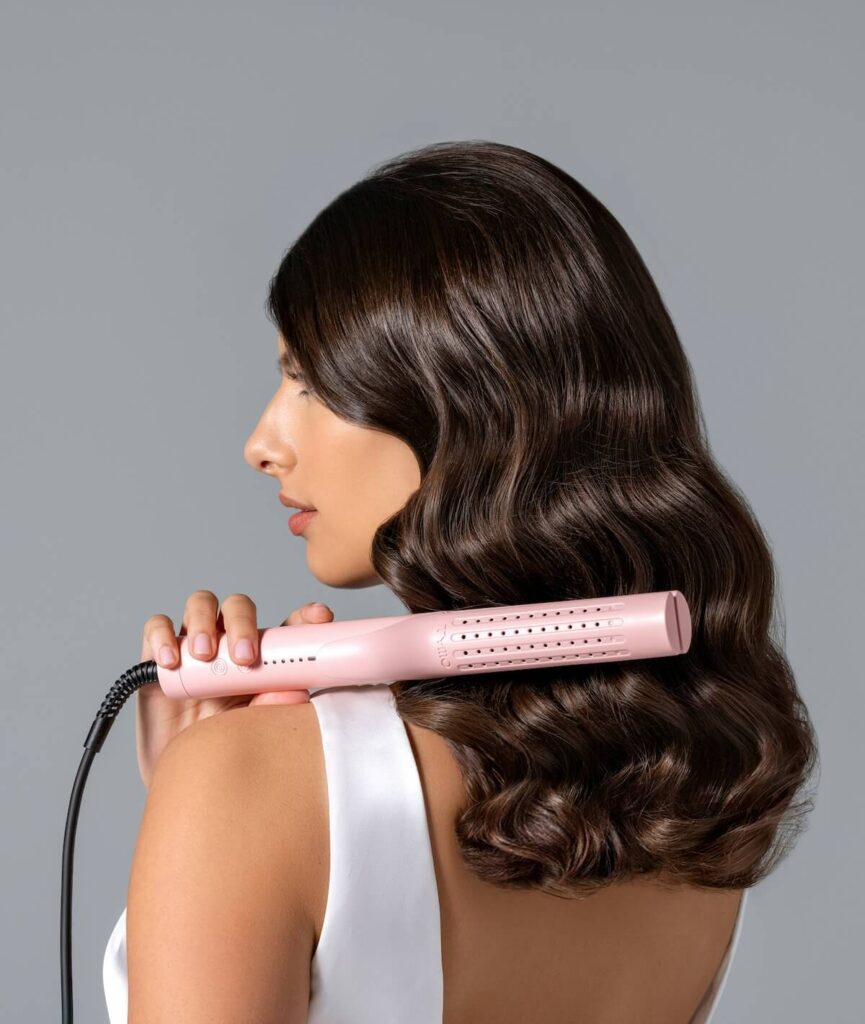 woman with curling iron