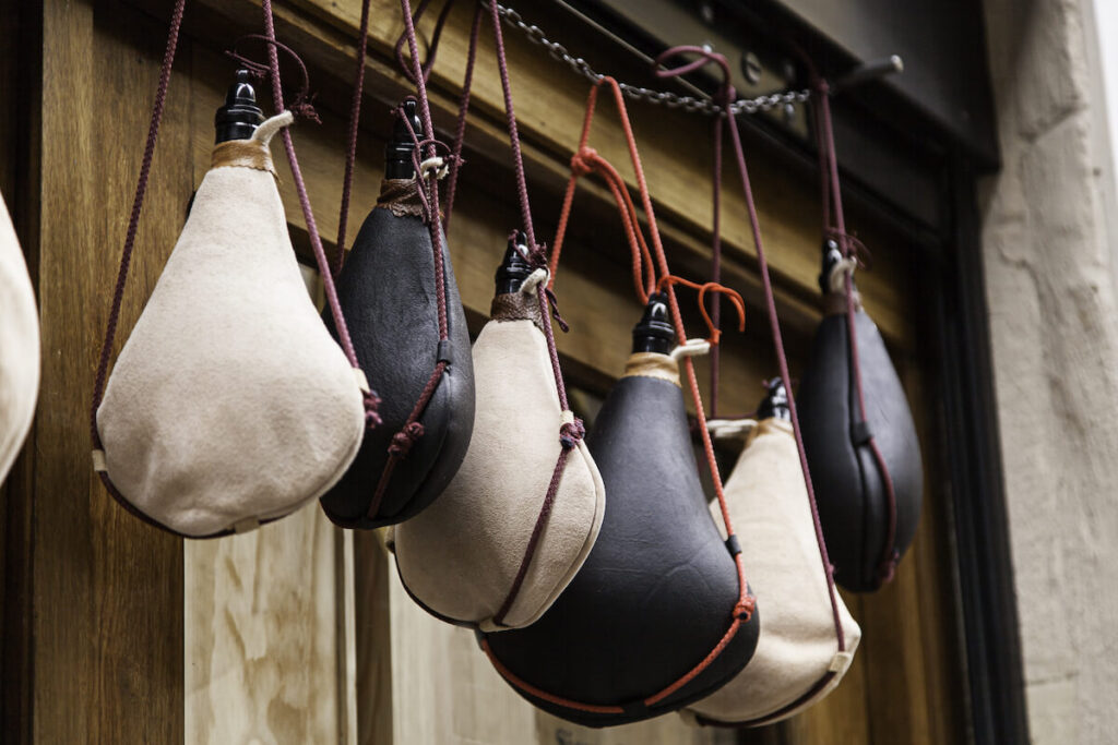 Wine leather boots hanging in store