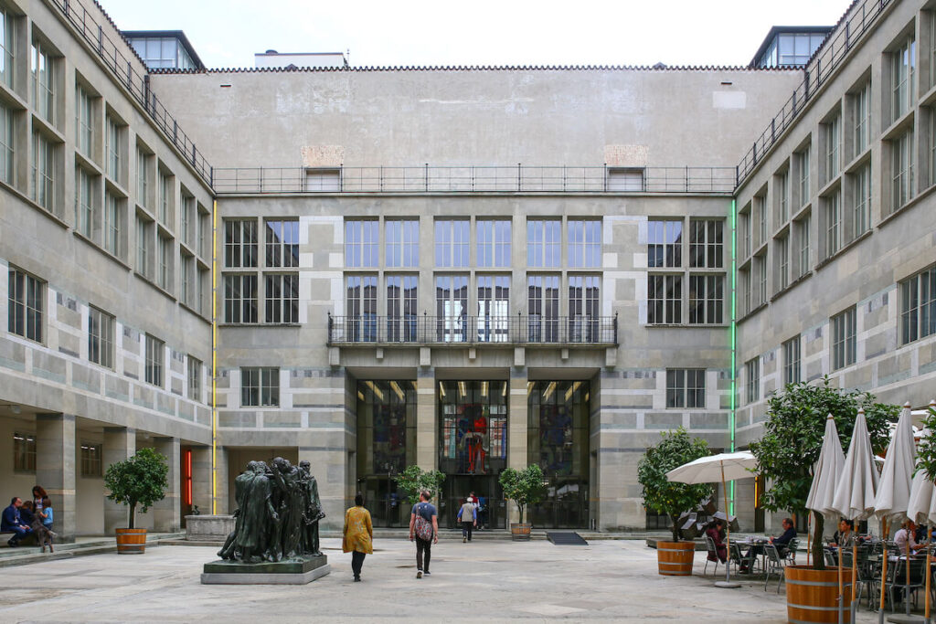 Walking in Basel in front of kunstmuseum, the old and the new buildings