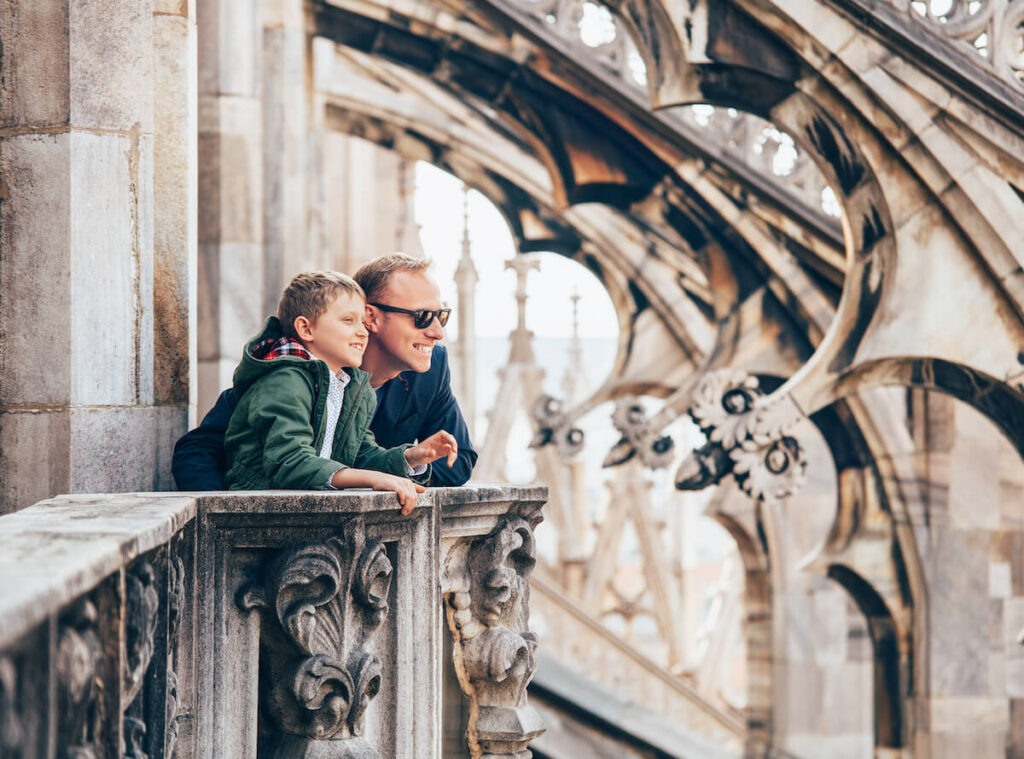 father and son atop Milan Cathedral