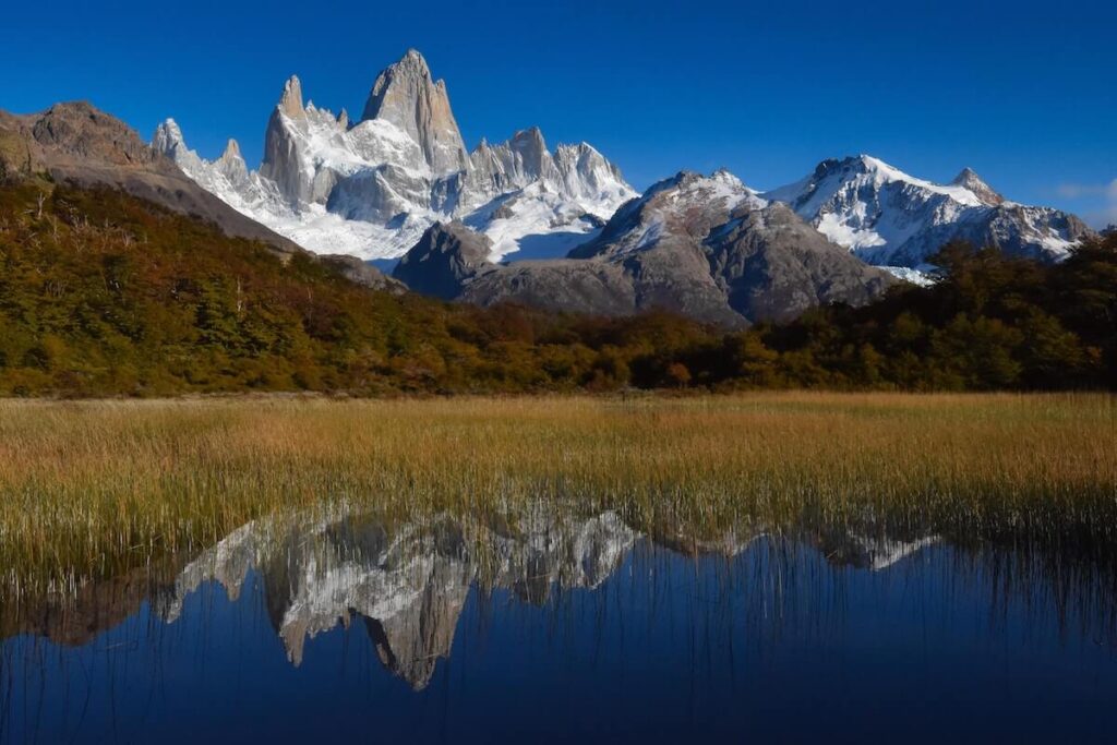 snow covered Mt FItz Roy with lake reflection
