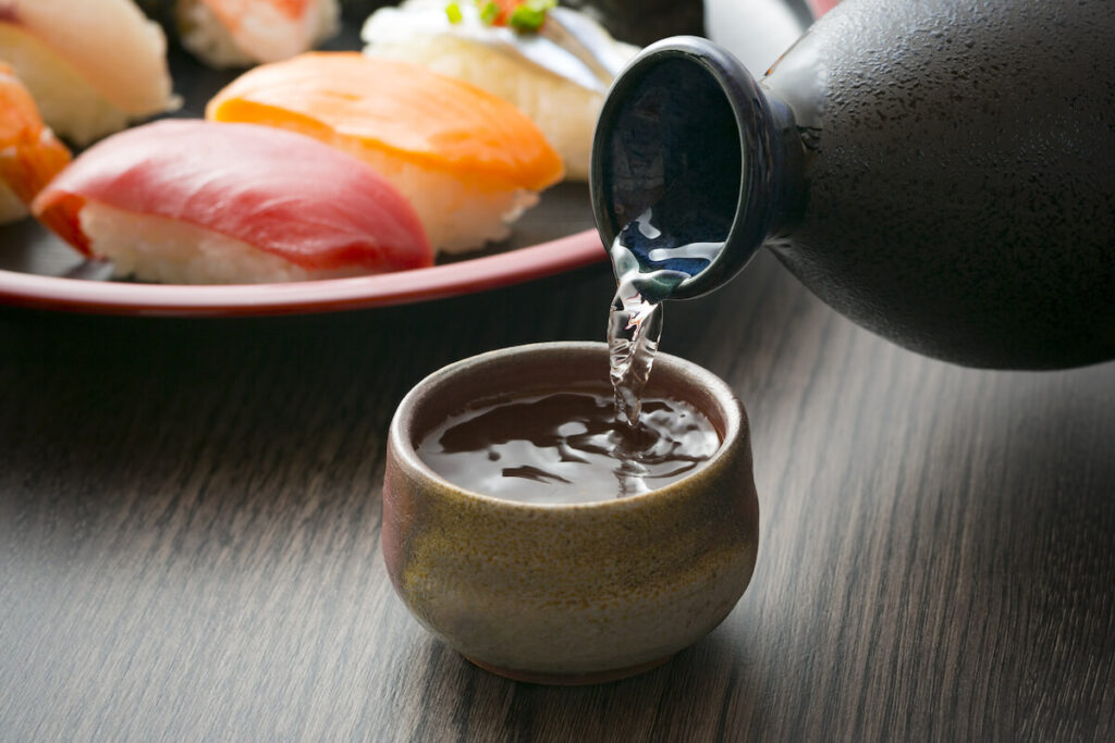 Japanese sake poured into ceramic bowl