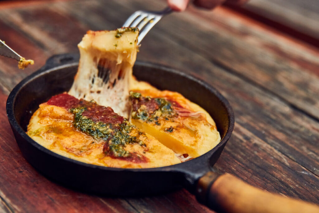 Provoleta chesse with pesto and tomato sauce