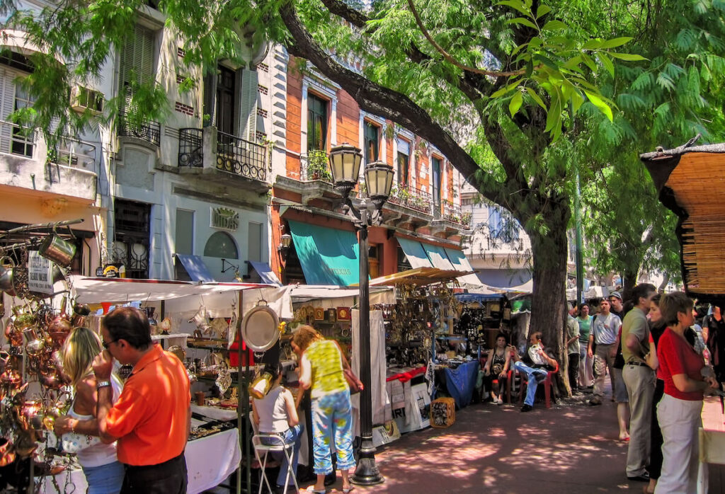 Tourists visit popular San Telmo outdoors market in old town Buenos Aires