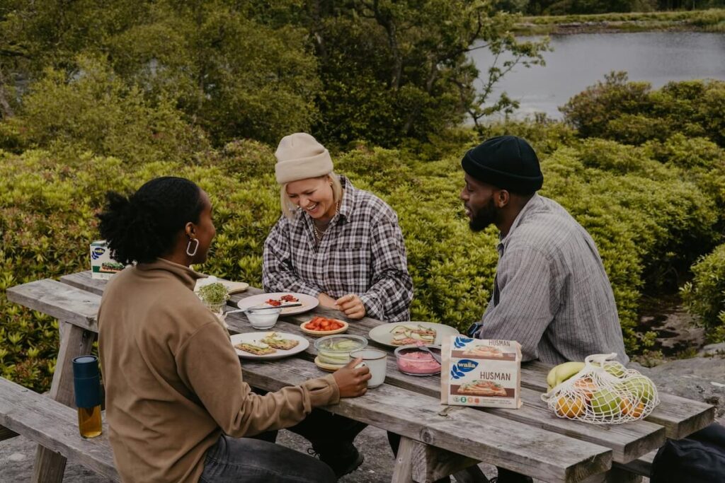friends eating Swedish crisp bread outside
