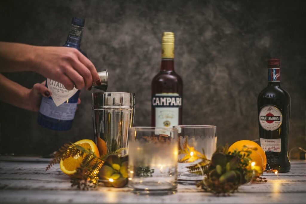 campari and martini bottles with glasses and decor