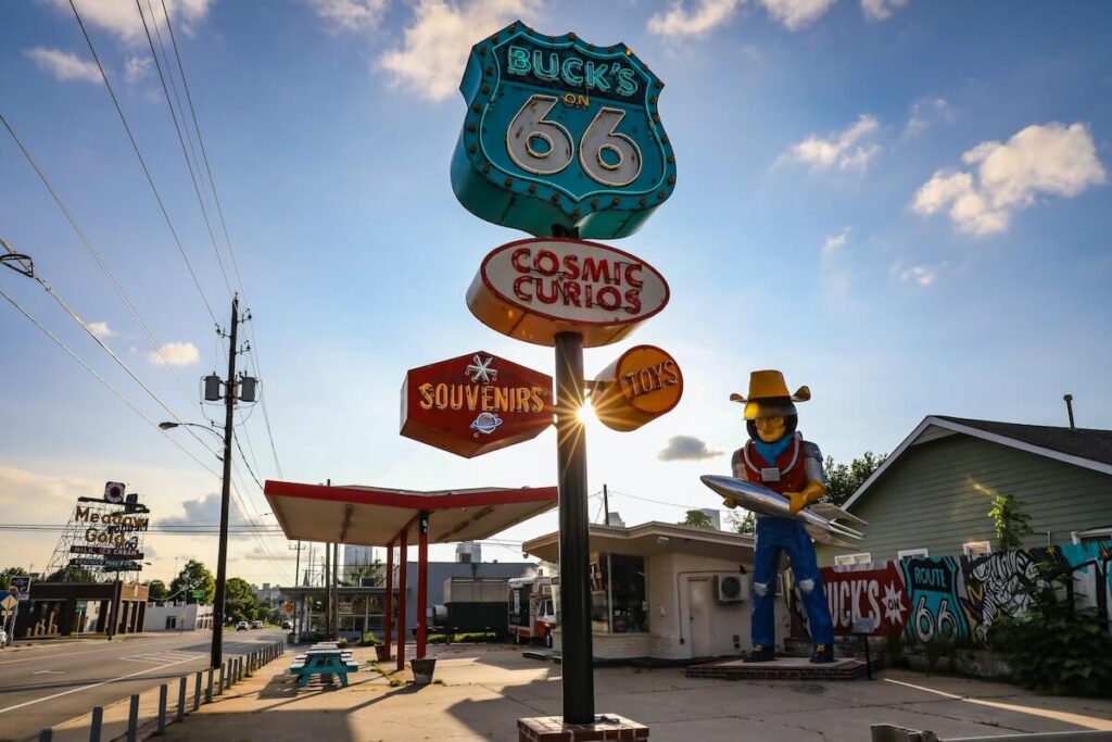 Buck on 66 Cosmic Curios sign