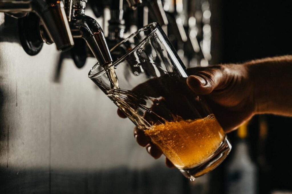 pouring craft beer on glass