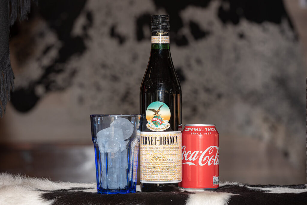 Typical Argentine drink, Fernet Braca with Coca Cola on cowhide