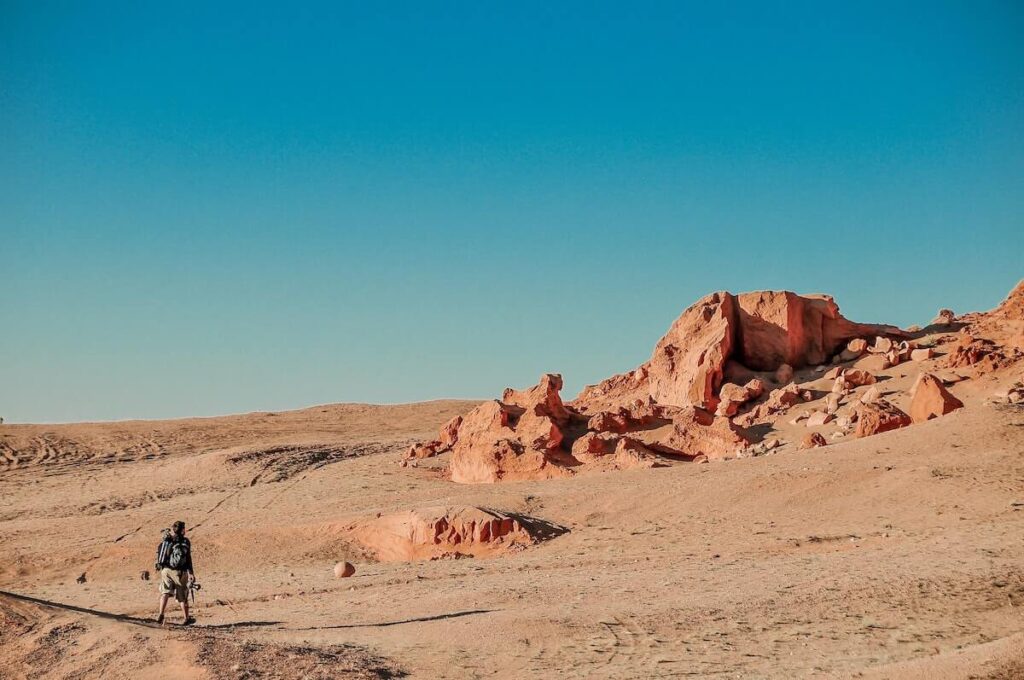 man crossing the Gobi Desert in Mongolia, one of the most majestic natural wonders in Asia