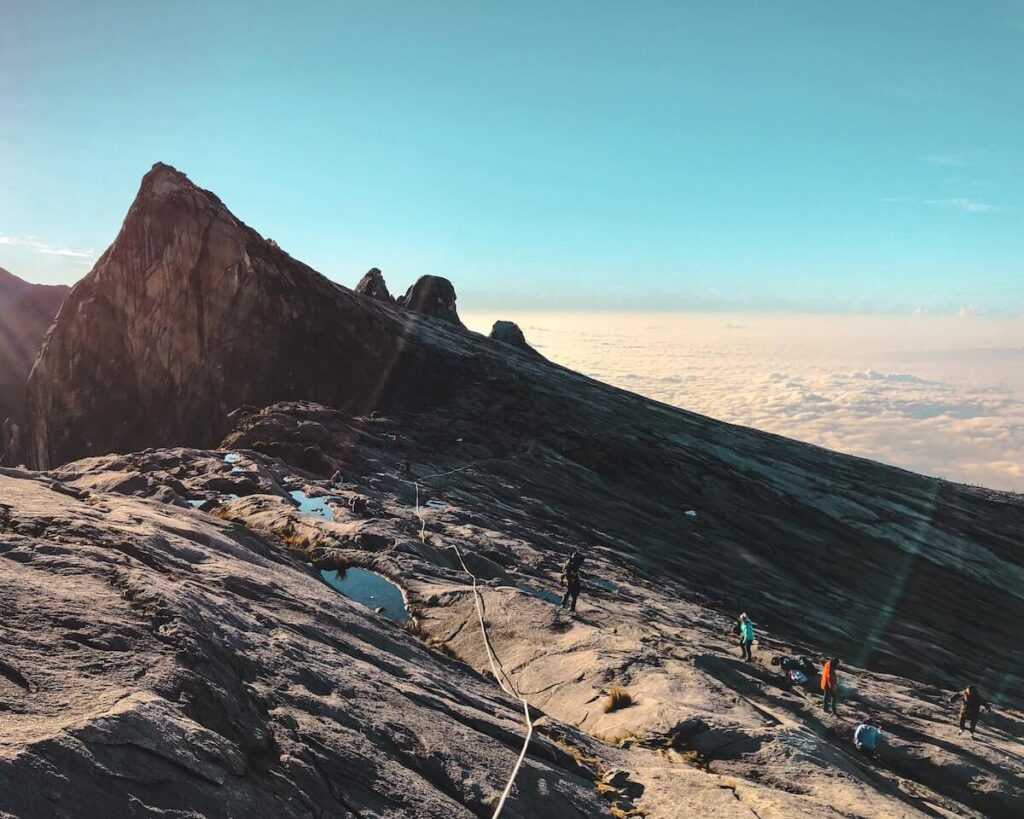 hikers on top of Mt. Kinabalu in Malaysia