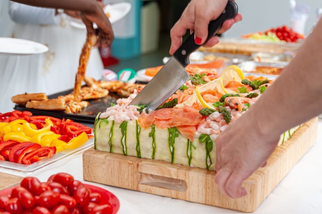 woman slicing a Swedish smorgastarta
