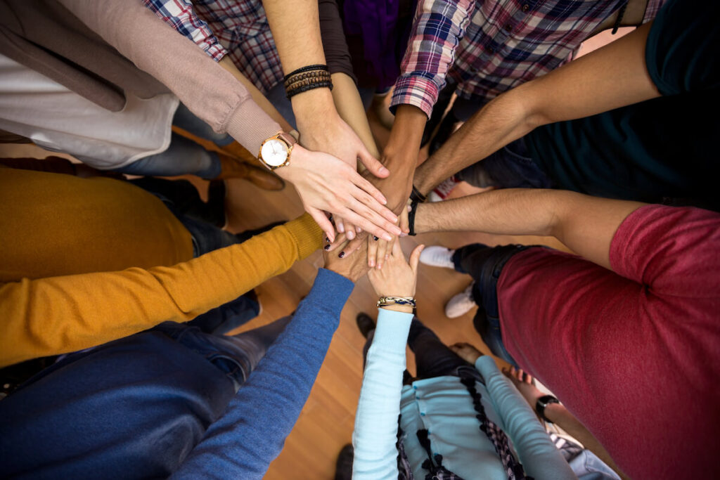 multiethnic team, all hands together