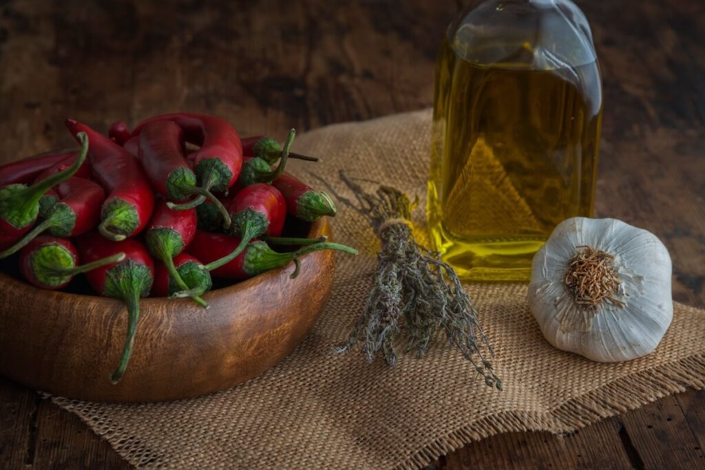 Still life olive oil, jalapenos, garlic and thyme