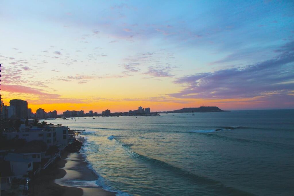 sunset over coast of Salinas in Ecuador