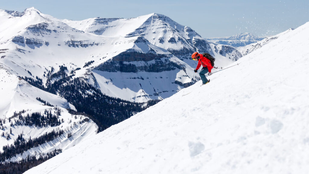 Big Sky Montana side country skier with Rocky on the background