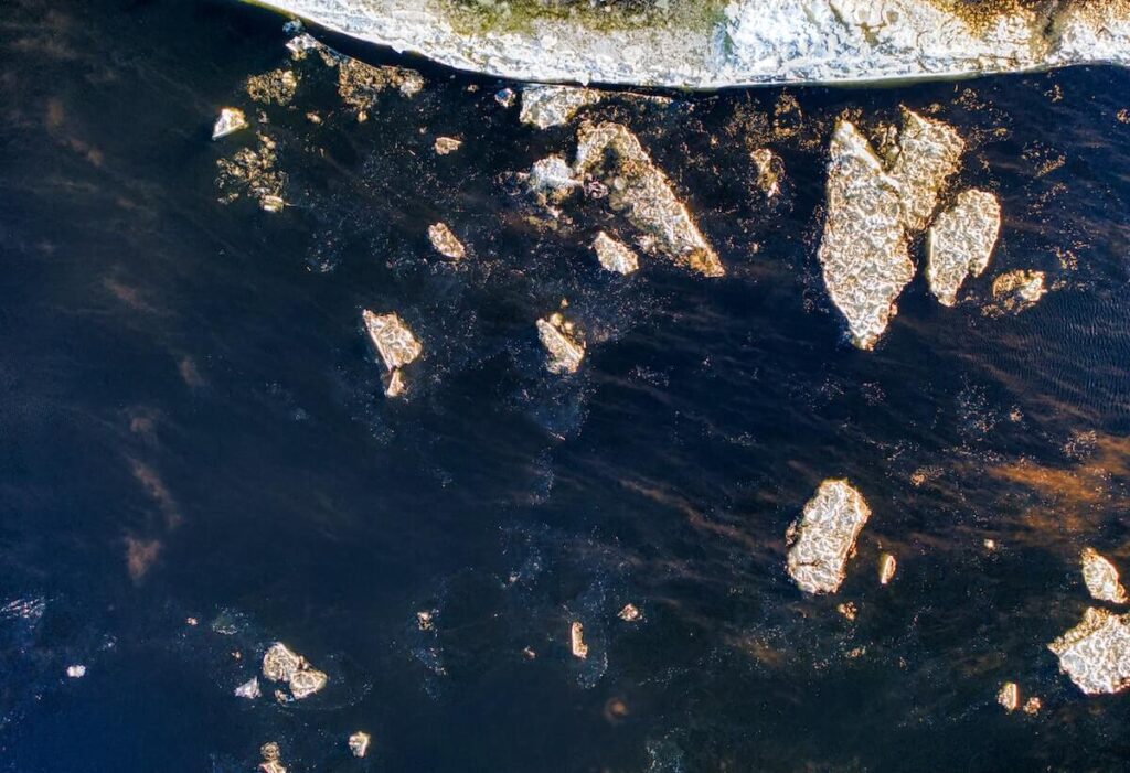 Ice floes floating on large river