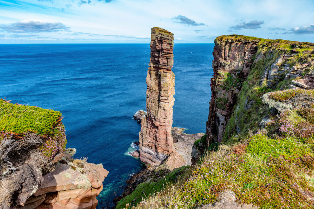 The view to the cliffs at The Old Man of Hoy sea stack on Hoy, part of the Orkney archipelago off the north coast of Scotland. This is one of the most beautiful natural wonders in the UK.