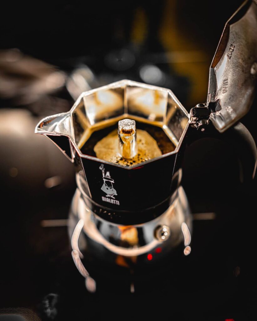 brewing coffee through Bialetti moka pot