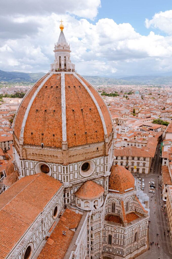 Overlooking the City of Florence with Mountains and a Cloudy Sky