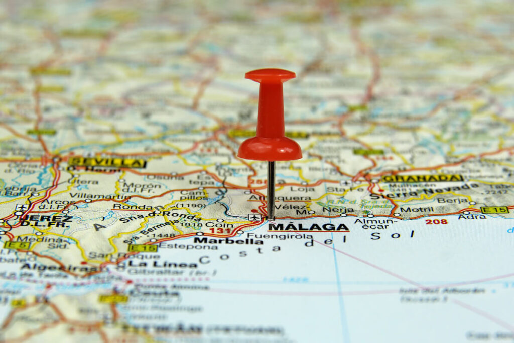 push pin pointing at Malaga, Spain