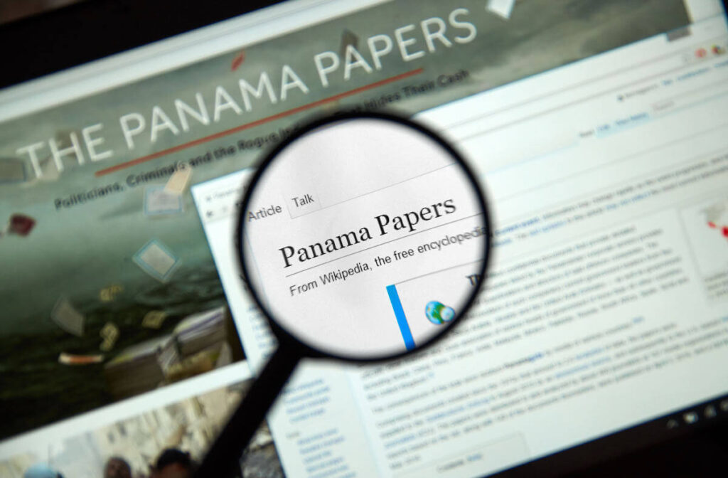 The Panama Papers web page under magnifying glass. It's a leaked set of 11.5 million confidential documents