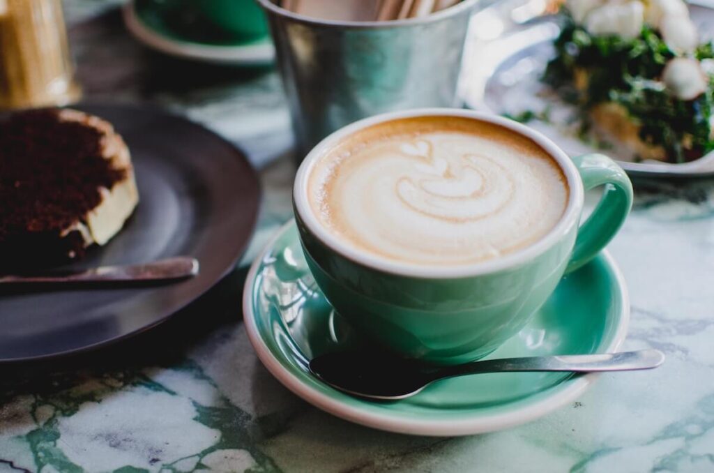 a cup of coffee and plate of pastry in a Montevideo cafe