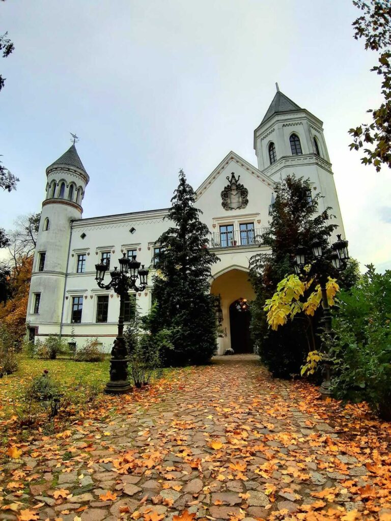 beautiful facade of Schloss Bredenfelde with autumn foliage