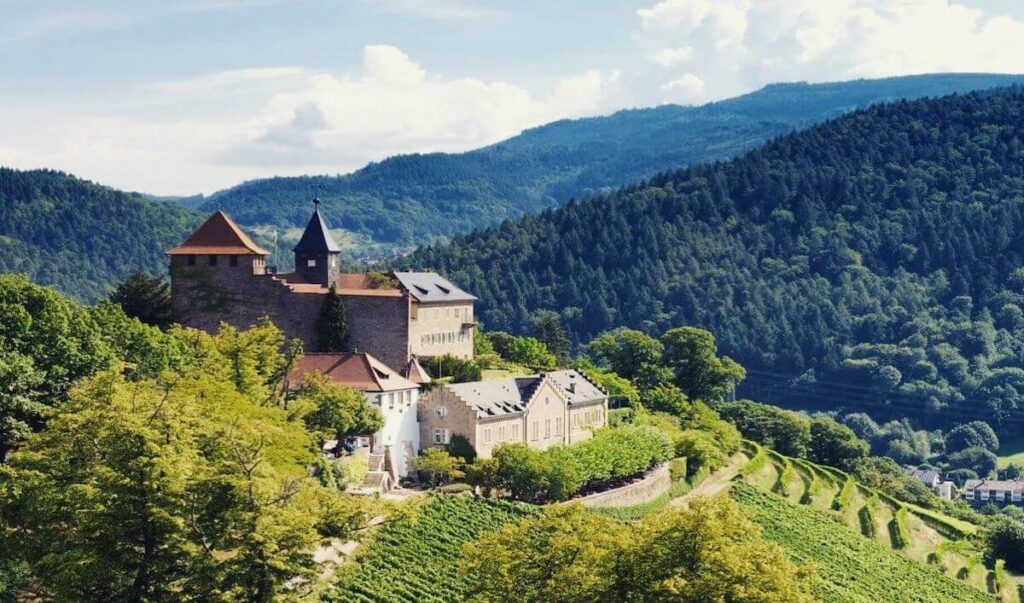 forests and mountains surrounding the towers and castles of Schloss Eberstein