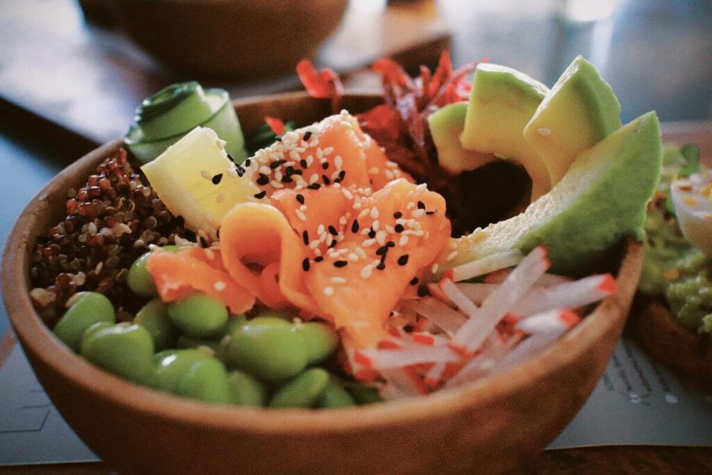 poke ball with fish, rice, veggies, and other toppings
