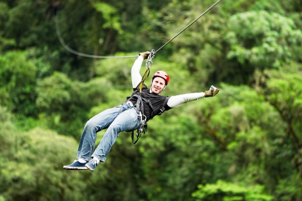 Male Tourist Wearing Casual Clothing On Zip Line