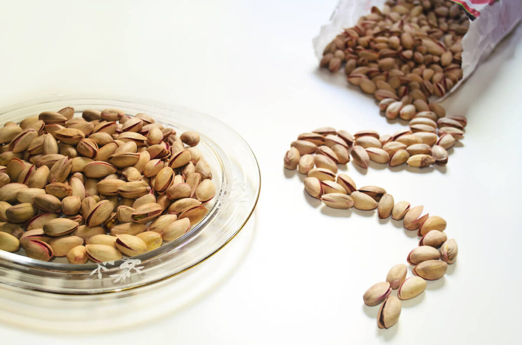 pistachio nuts aegina nuts peanuts on table
