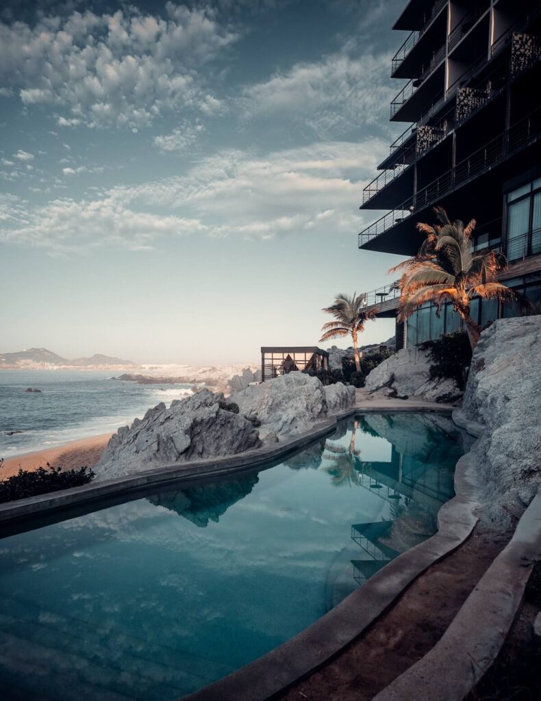 Beautiful sunrise in Cabo San Lucas with an inviting pool