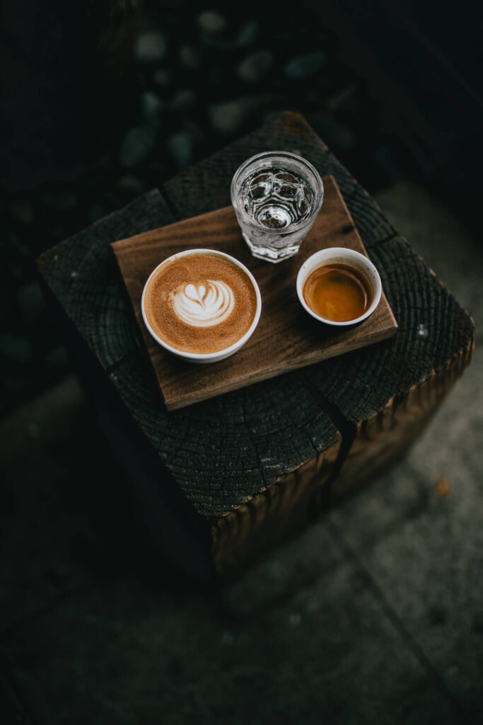 two cups of coffee and a glass of water