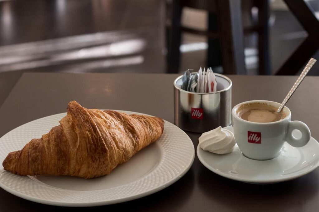 breakfast of croissant and cappuccino
