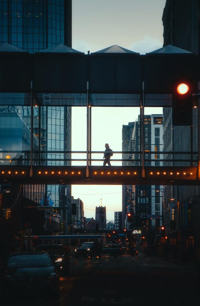 man walking on an elevated walkway in Minneapolis