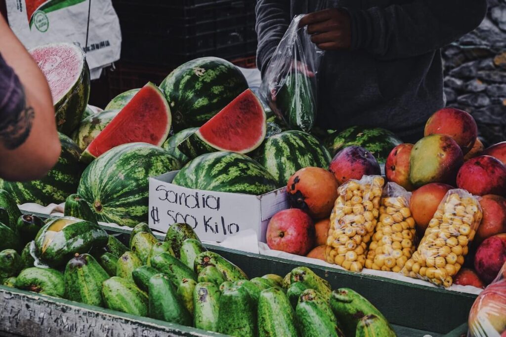 watermelons and other fruits in a fruit stand in Costa Rica. Fruits are an important part of Costa Rican food culture