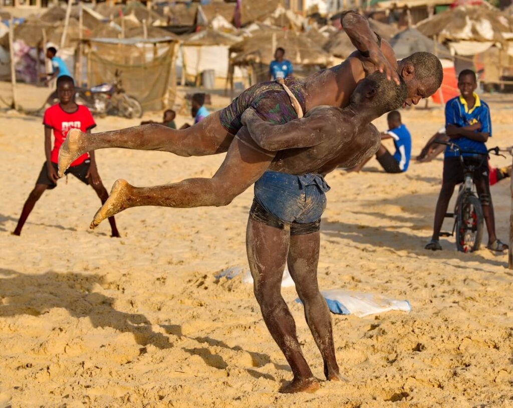 Two Senegalese wrestlers on the seashore participate in a Laamb wrestling match. Laamb is the only martial art where blows are struck with bare hands.
