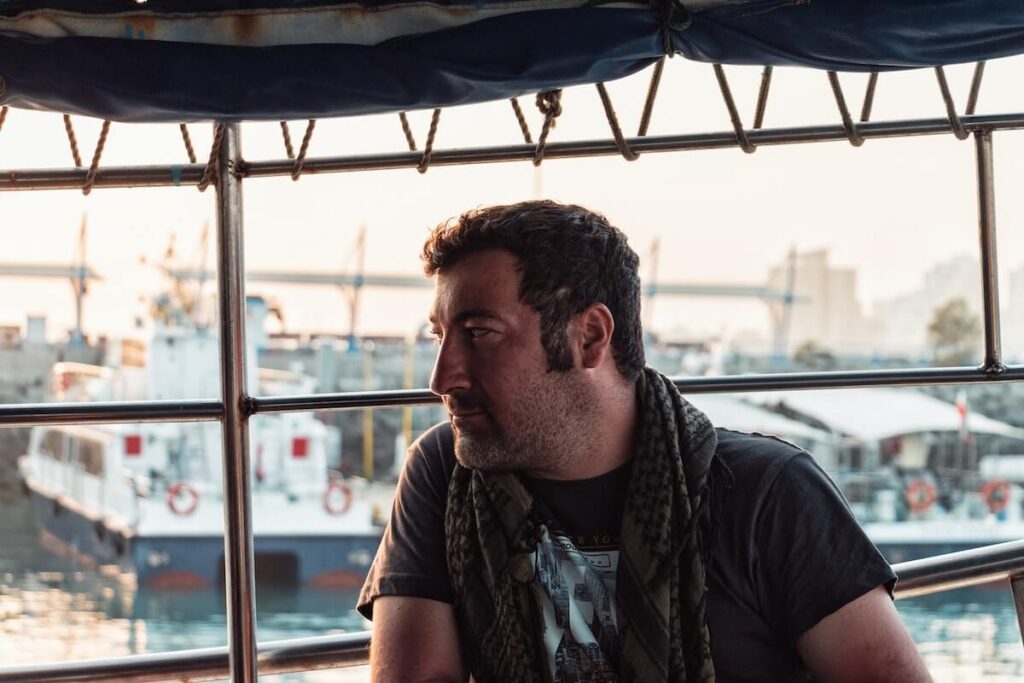 man with a sideburn inside a boat
