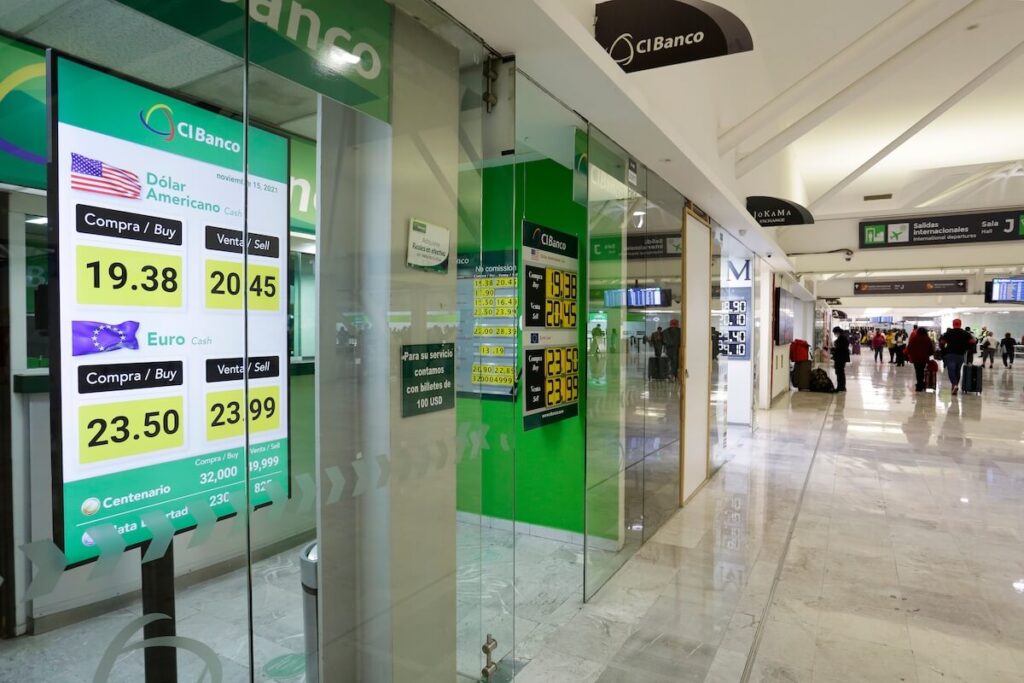 A foreign currency board displays the US Dollar and Euro rates inside a currency exchange shop in Mexico City international airport.