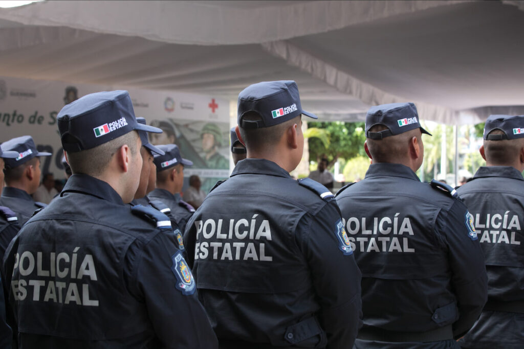 Mexican police officers standing guard