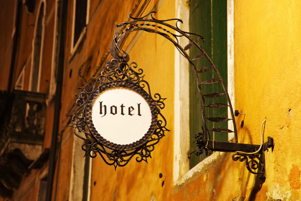 old Venetian hotel sign at night