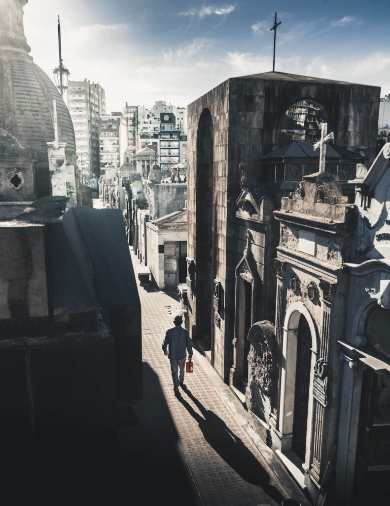 man walks through recoleta cemetery